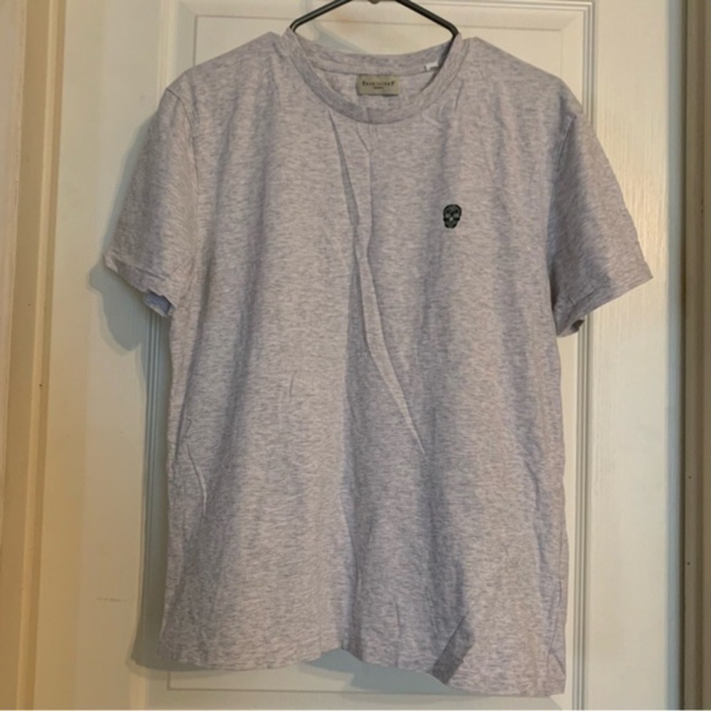 Light Gray Short-Sleeve T-Shirt with Subtle Skull Logo